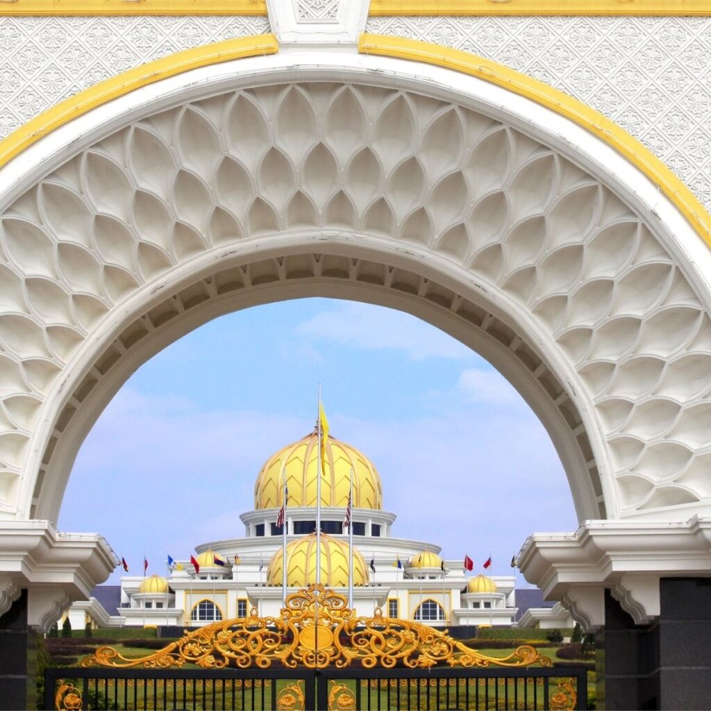 A view of Istana Negara, the King's Palace in Kuala Lumpur, Malaysia, taken from the grand front gate looking toward the majestic golden dome palace complex