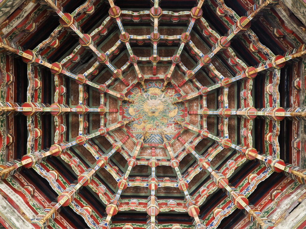 The incredibly intricate wooden spider-web caisson ceiling structure inside Lukang Temple.